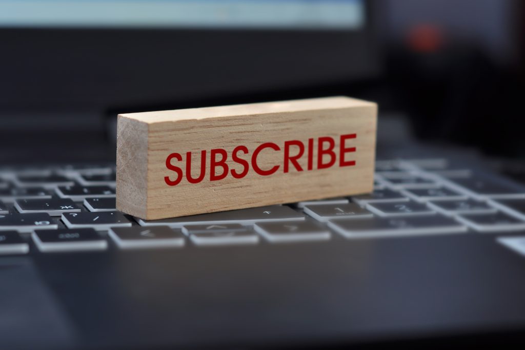 newsletter image A wooden cube with the inscription: "subscribe". A symbol for subscribing to an online newsletter for strengthening the set briefings